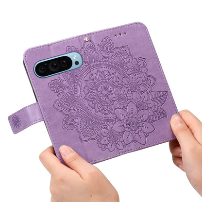 For Google Pixel 9 7-petal Flowers Embossing Leather Phone Case(Light Purple) - Google Cases by buy2fix | Online Shopping UK | buy2fix